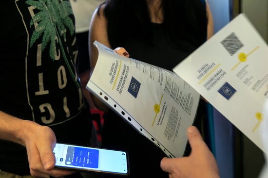 Passengers show their EU Digital COVID Certificates in Greece (photo from European Commission)