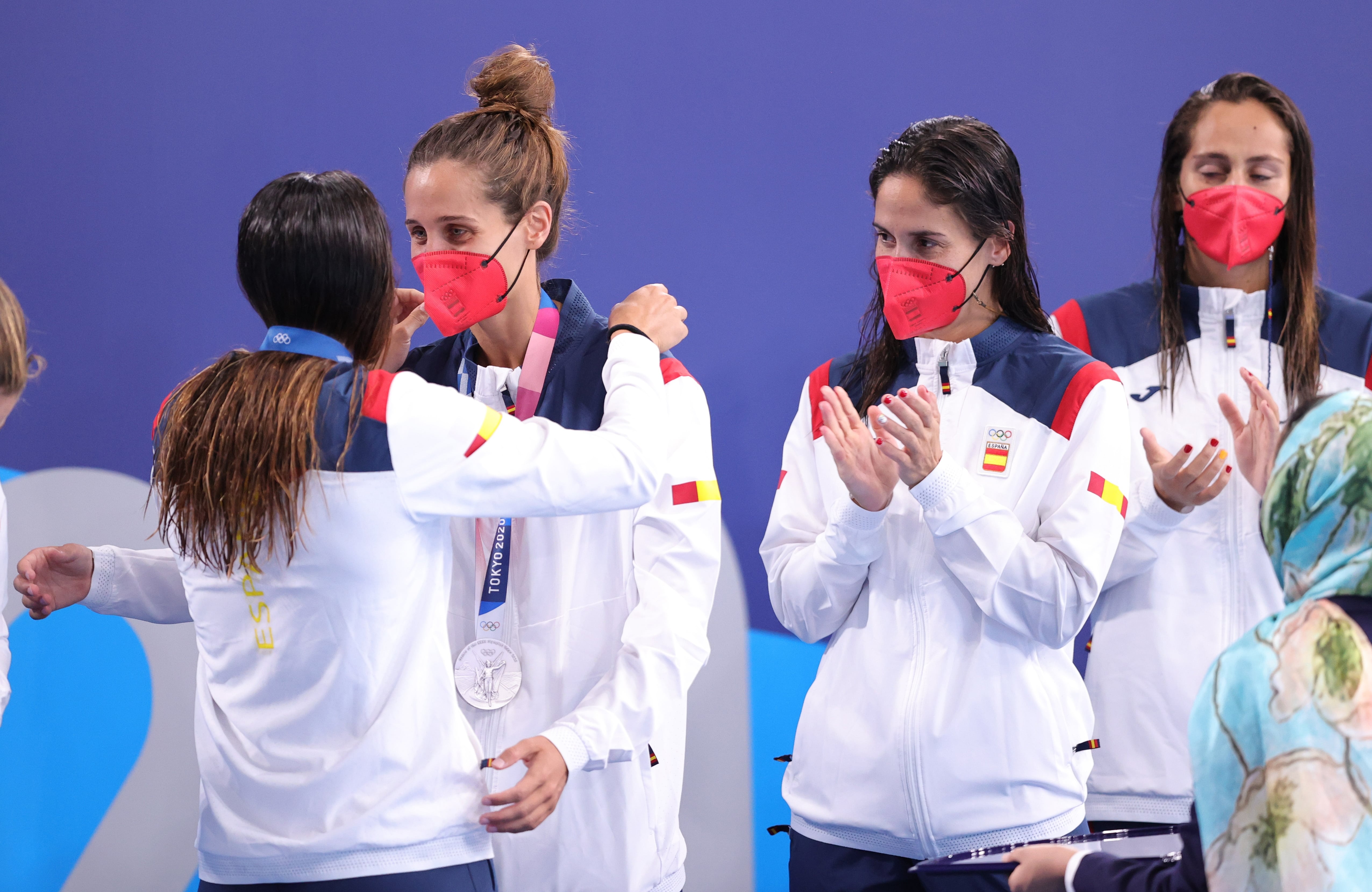 Members of Spain's women's water polo team collect their silver medals at the 2020 Summer Olympics (image by Henry Romero/Reuters)