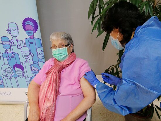 A 93-year-old care home resident gets a Covid-19 vaccine