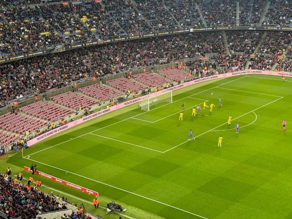 An empty stand behind the goal at the Camp Nou on the night that some fans protested against the handling of ticket sales against Eintracht Frankfurt (by Cillian Shields)