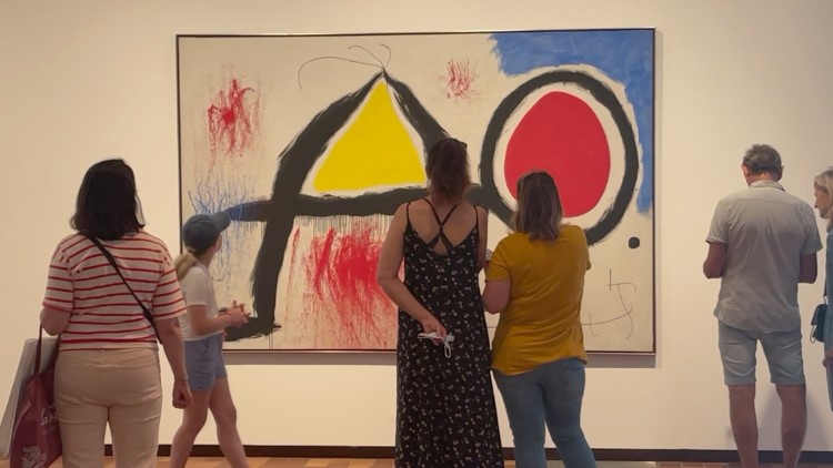 Visitors contemplate Miró's 'Figure in front of the sun' at the Fundació Joan Miró, Barcelona (by Cillian Shields)