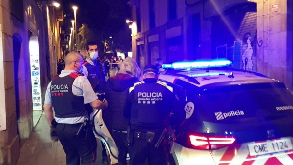 Police officers arresting a person in Barcelona