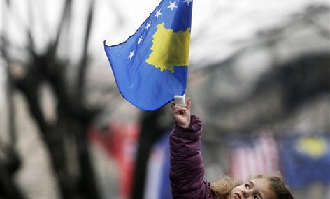 A girl with Kosovo's flag