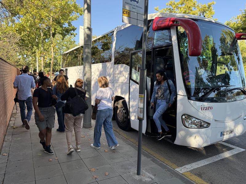 Commuters getting off a alternative bus in Castelldefels