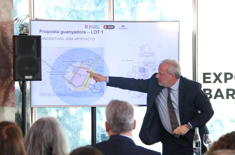 Director general of the Fira de Barcelona, Constantí Serrallonga, points out some of the architectural plans in the remodelling project