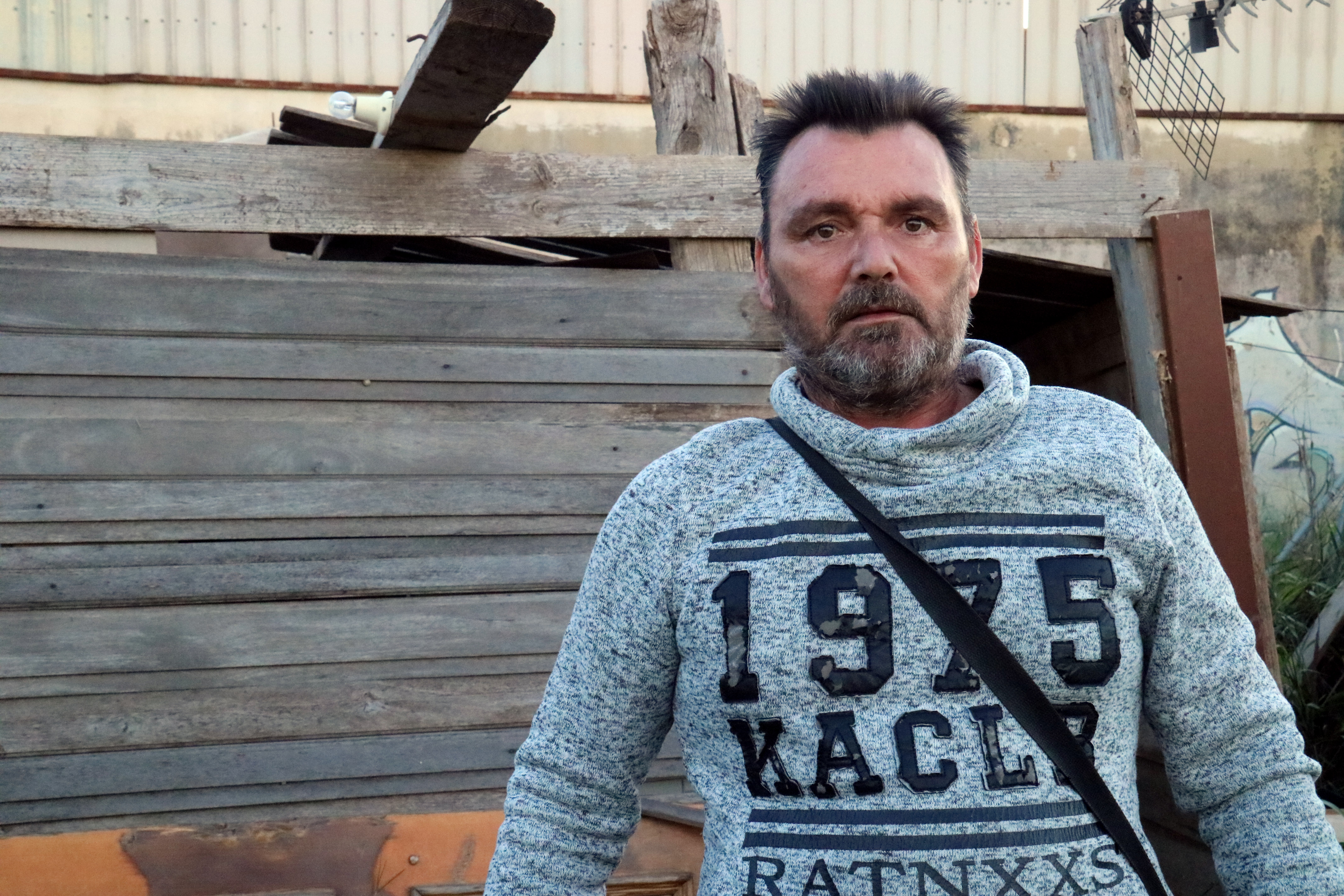 Pep Santamaria outisde the caravan in Parc Alcosa where he lived before the floods