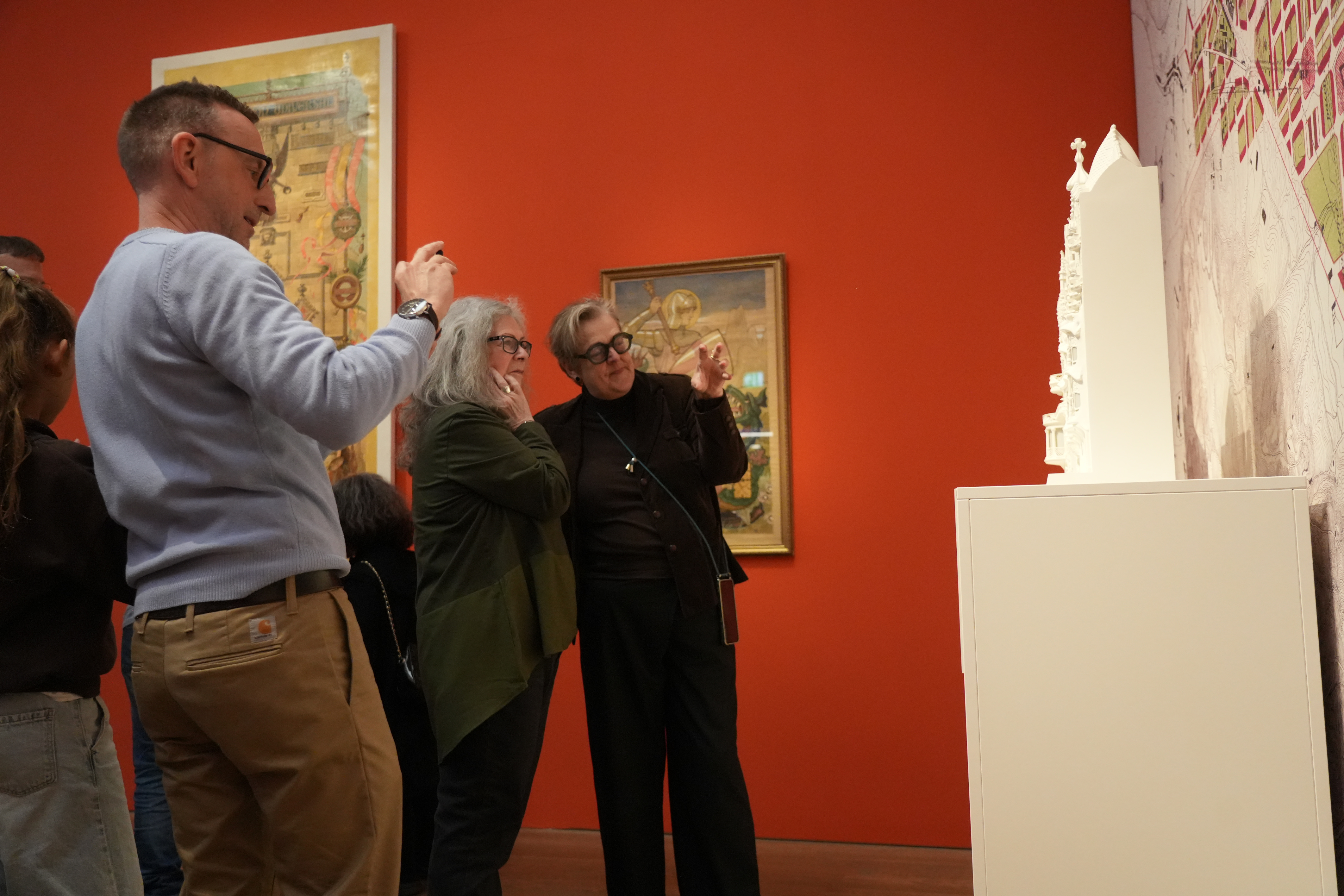 A visitor observing several works from the exhibition 'Modern Barcelona: From Gaudí to Picasso' at the Kunsthalle München