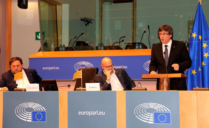 Catalan government members in 2017, Oriol Junqueras, Raül Romeva, and Carles Puigdemont, during a conference in the European Parliament on January 24, 2017