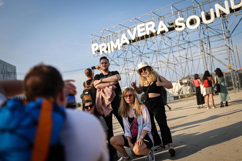 Fans pose for a photograph at the entrance to the Primavera Sound festival in Barcelona in 2023