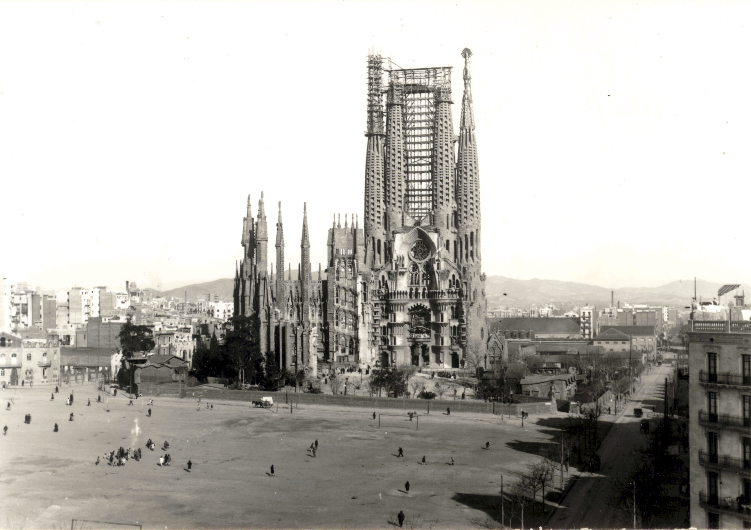 The Nativity facade, under construction, in a historical image from the 1920s