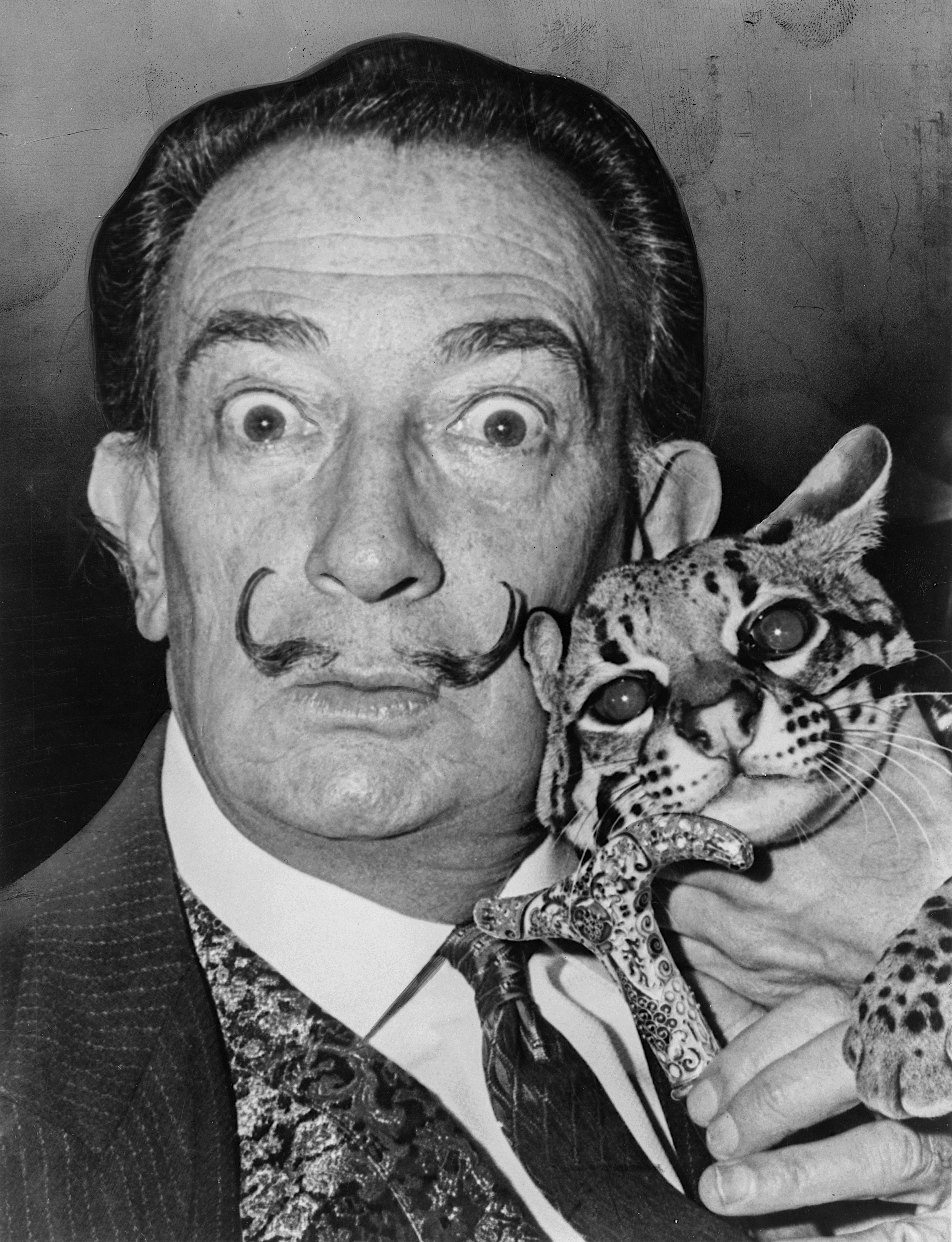 Salvador Dali with his pet ocelot Babou.