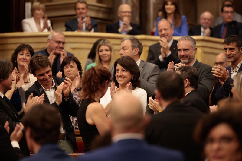 The new Catalan parliament speaker, Anna Erra, is applauded by colleagues after being appointed to the role