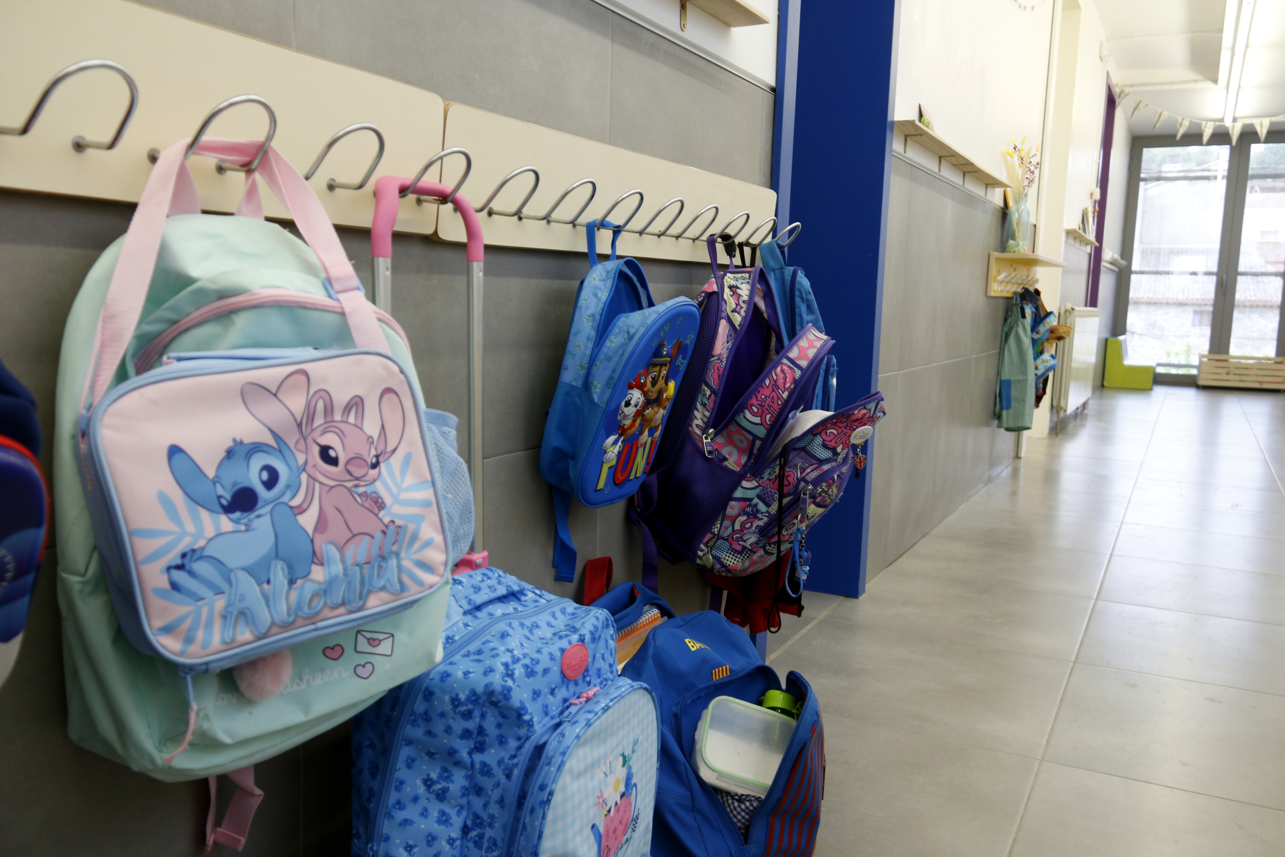Backpacks hanging outside a classroom in western Catalonia