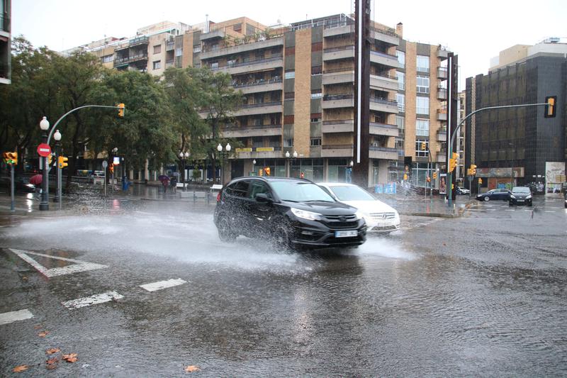 Cars drive through the rain in Tarragona