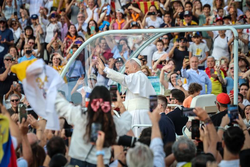 Pope Leo XIV salutes the faithful in the Olympic Stadium from the Popemobile