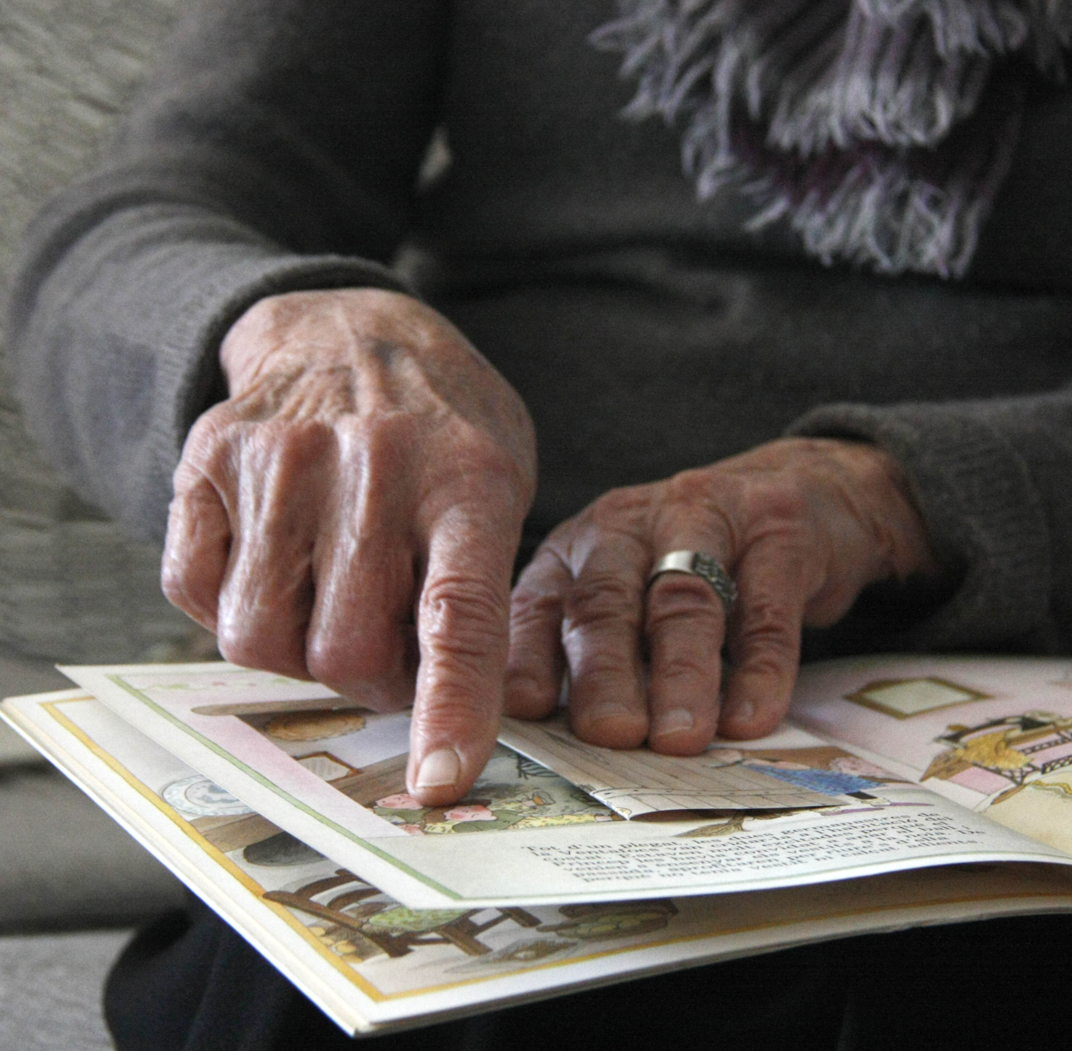 The illustrator, creator of 'The Triplets', Roser Capdevila showing one of her copies