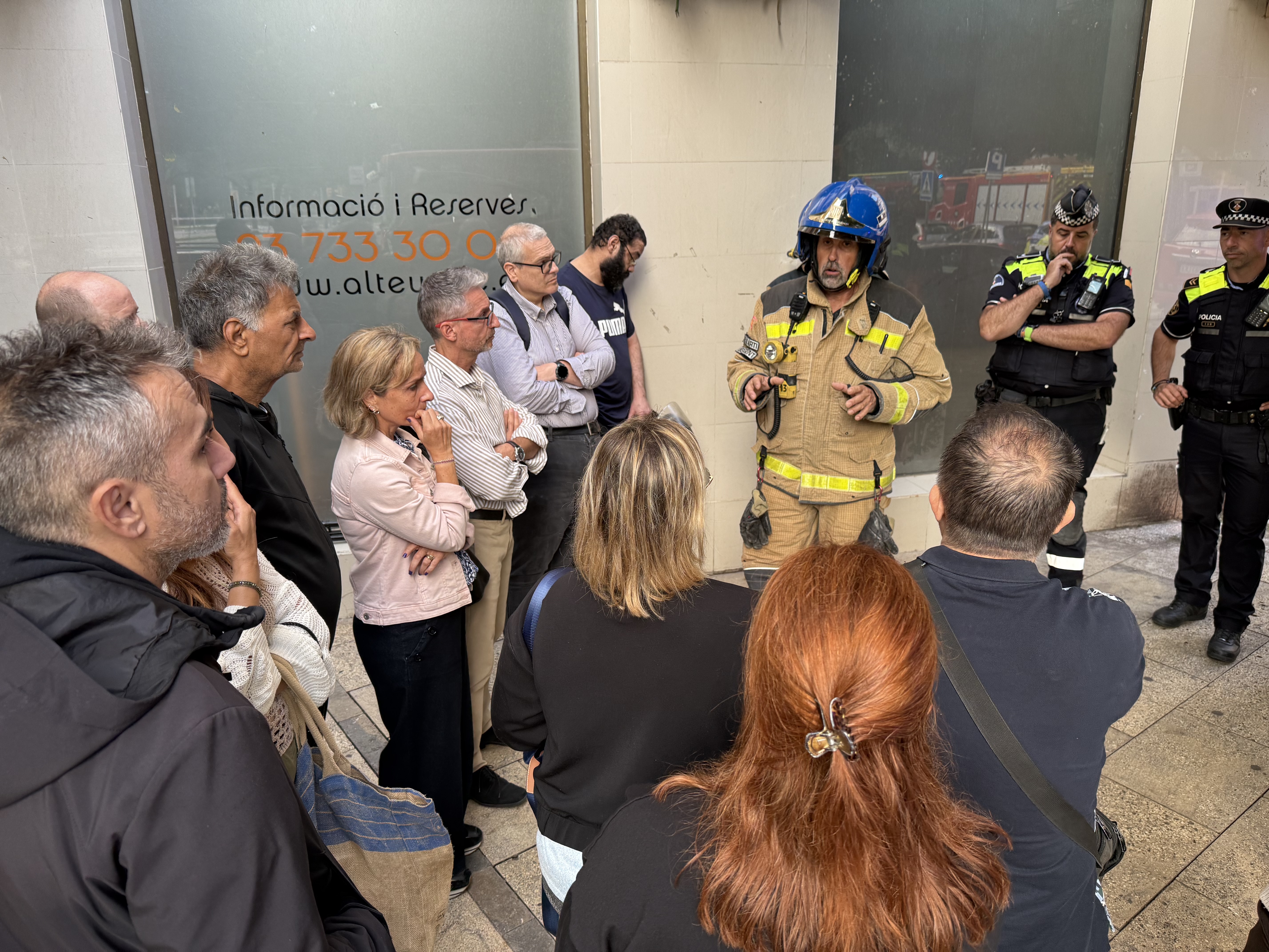 Firefighters meet with the residents affected by the gas leak