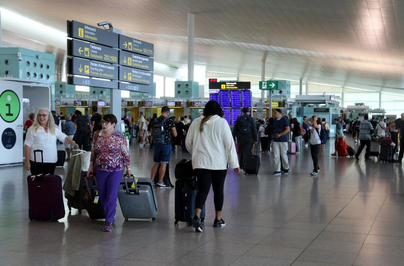 Passengers at Barcelona El Prat airport's terminal 1