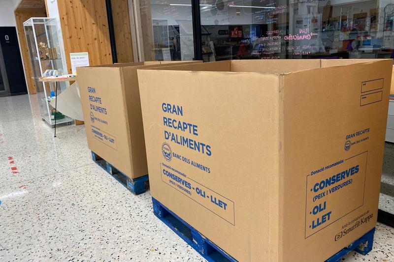 Boxes in a library in Barcelona's Les Corts neighborhood to collect goods for those affected by the floods in Valencia