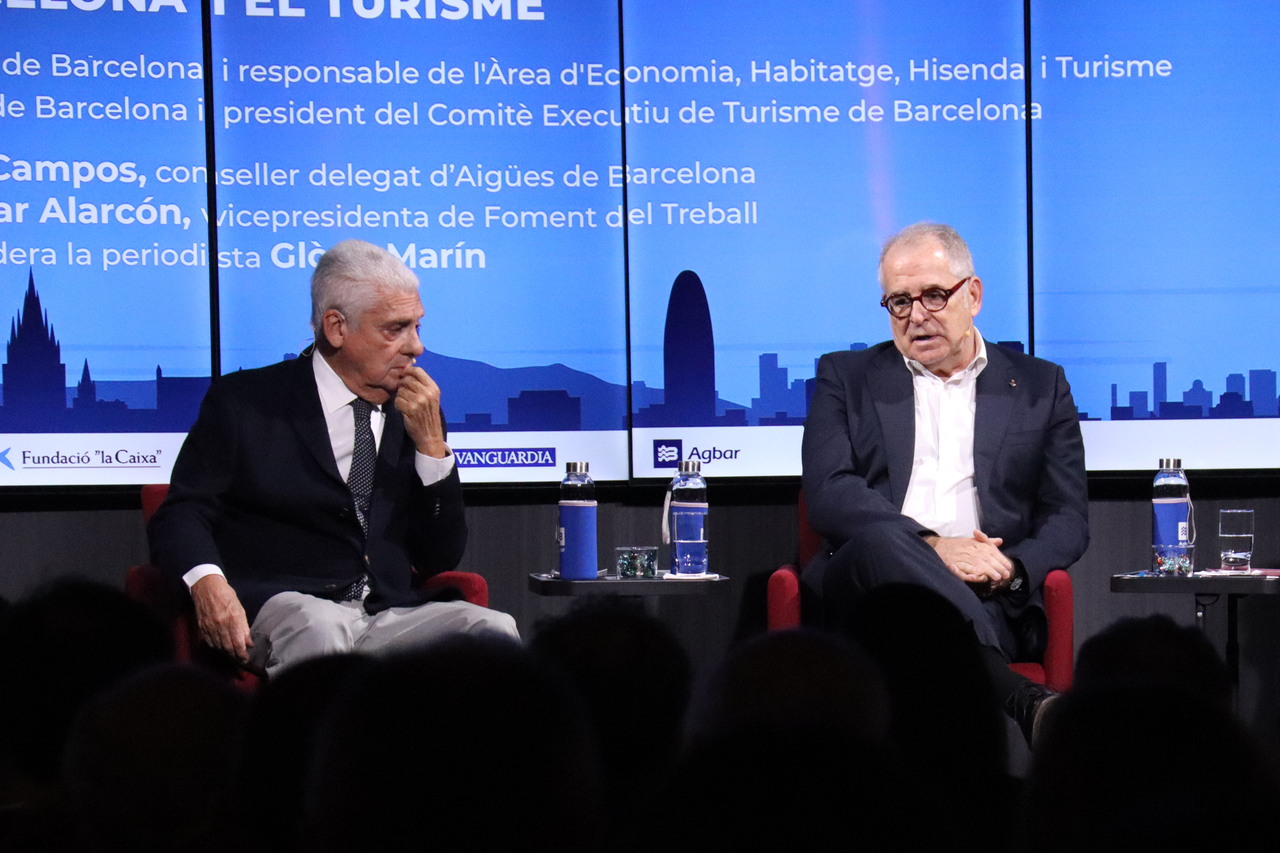 Hotels' guild president Jordi Clos (left) and Barcelona city councilor Jordi Valls (right) during a debate on tourism at the Foment headquarters on October 28, 2025
