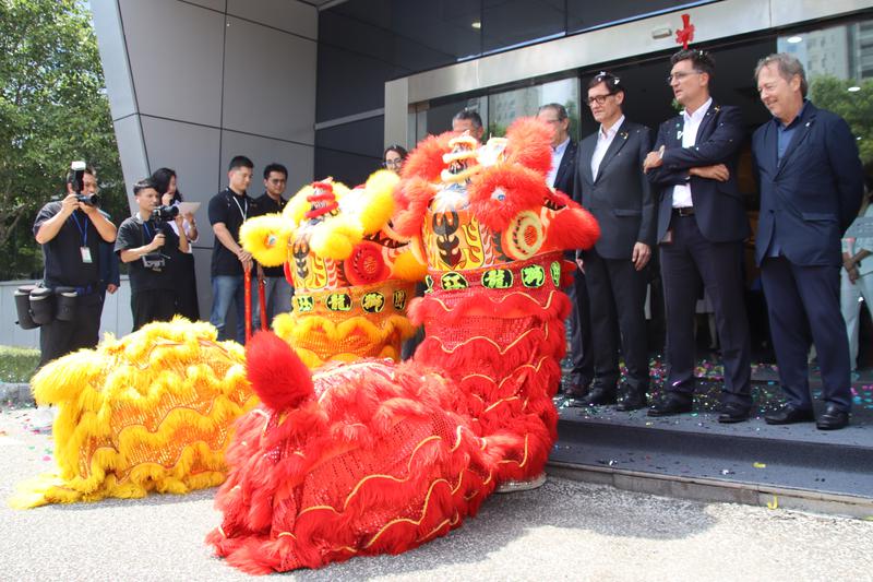 Two traditional Chinese dragons greet Catalan president Salvador Illa during a visit to the Catalan company Ficosa's factory in Taicang, China