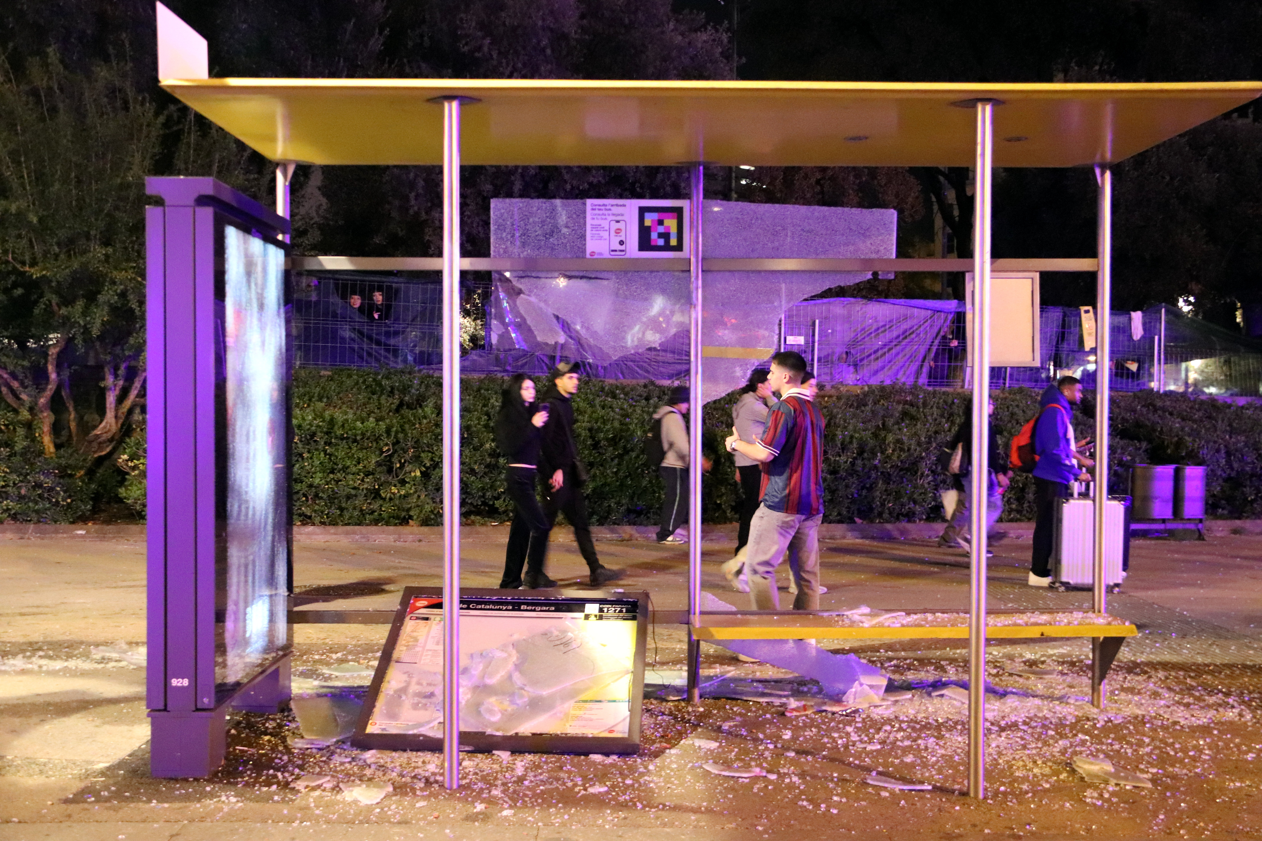 Damage to a bus stop at Plaça de Catalunya following the disturbances