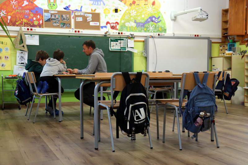 A teacher in a class with two students