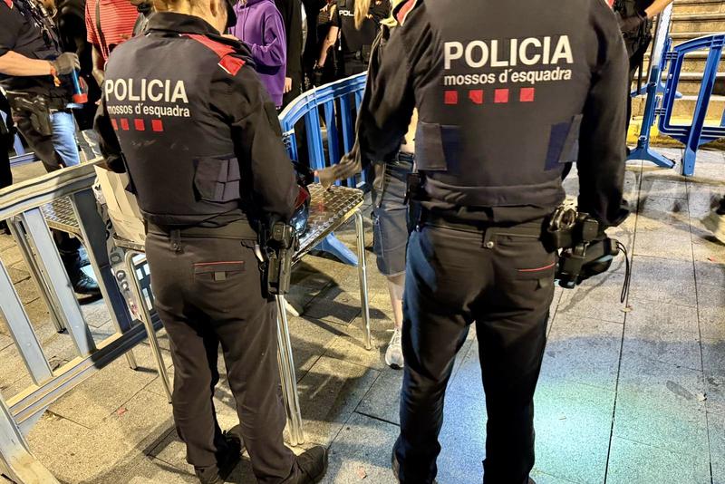 Mossos d'Esquadra police performing checks during the Molins de Rei festa major