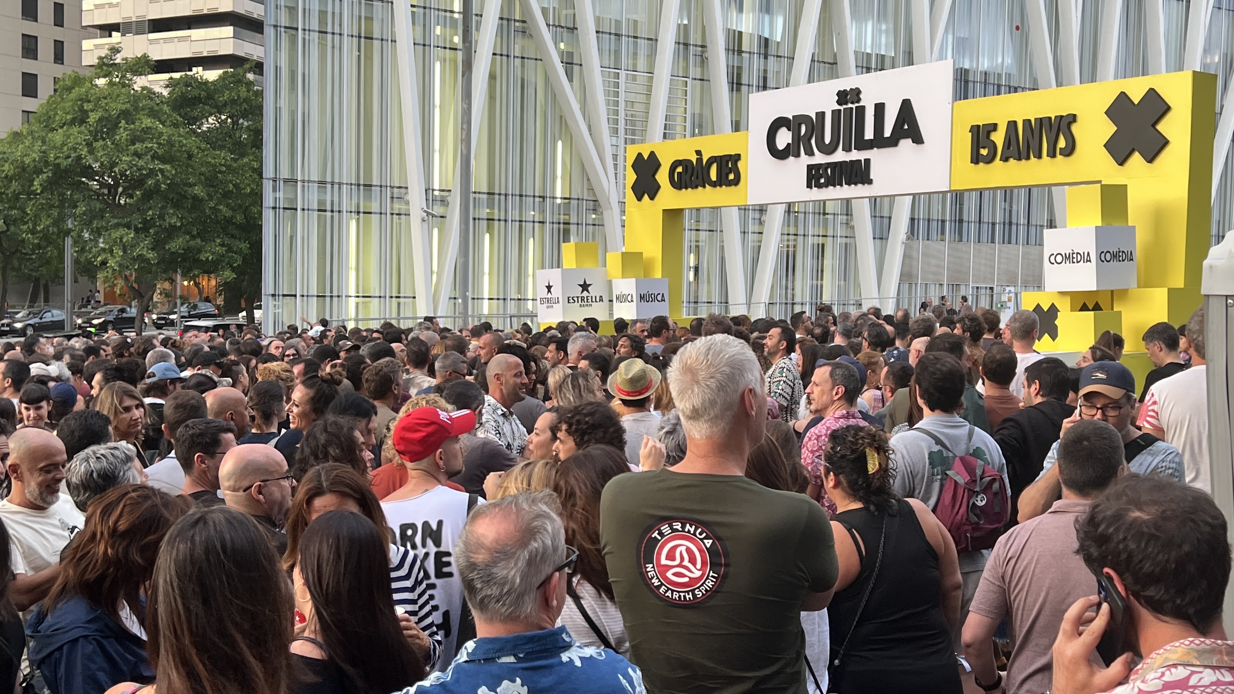 Queues formed to enter Cruïlla at Parc del Fòrum after the opening was delayed due to the heavy rain