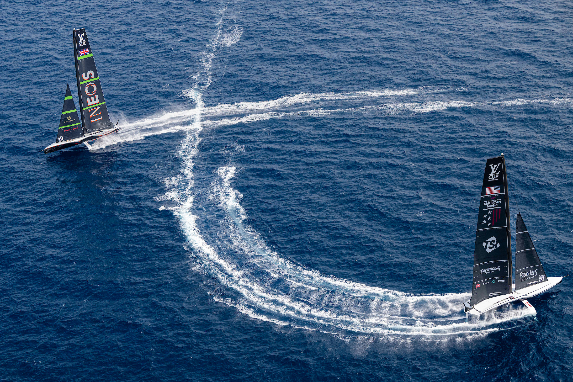 Ineos Britannia and NYYC American Magic sailing during one of the America's Cup sails off the shore of Barcelona