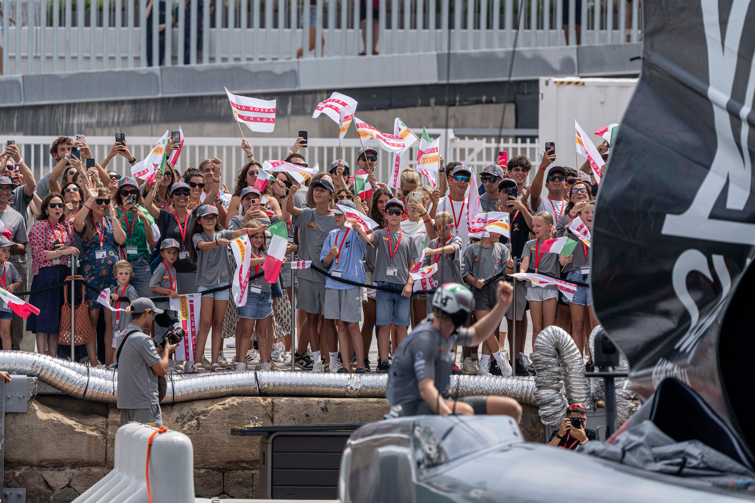 Many Italian team fans bid farewell their sailors ahead of one of the first race of the Preliminiary Regatta of the America's Cup in Barcelona on August 22, 2024