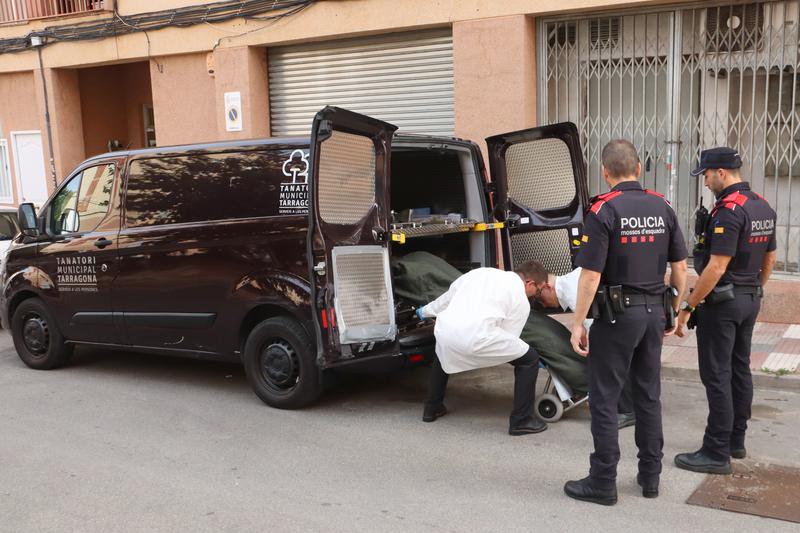 Medical staff and police at the scene of the killing in Tarragona