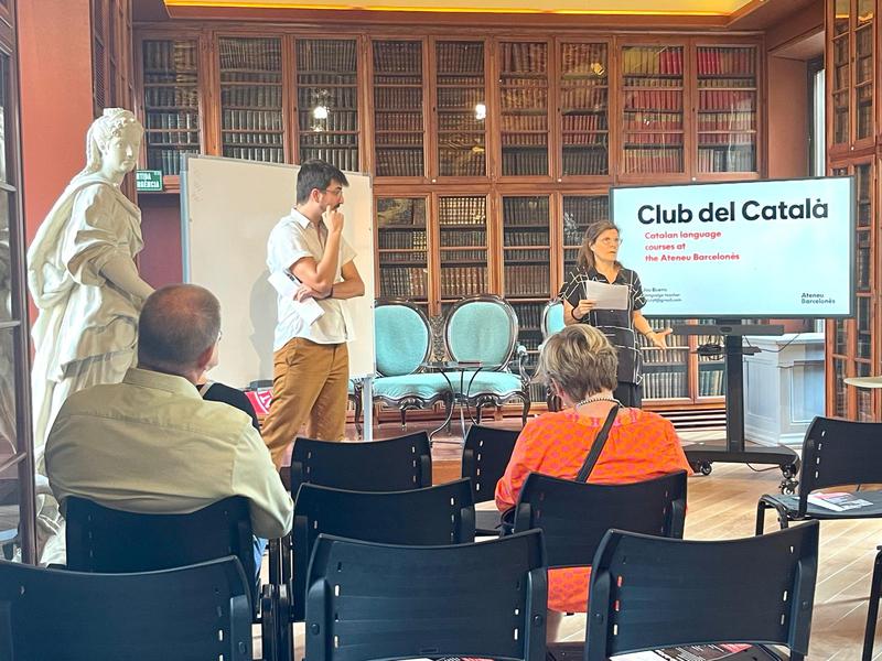 Organizers of the Catalan language courses at Ateneu Barcelonès inform visitors of the courses on offer