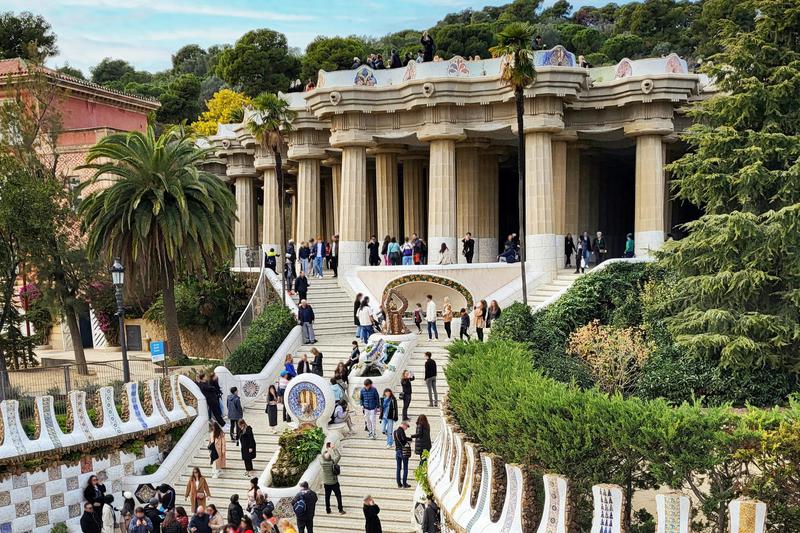 The main stairs of Park Güell in Barcelona with the dragon, designed by architect Antoni Gaudí