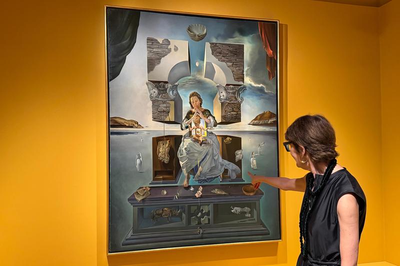 The director of the Dalí museums, Montse Aguer, photographed with 'The Madonna of Port Lligat'