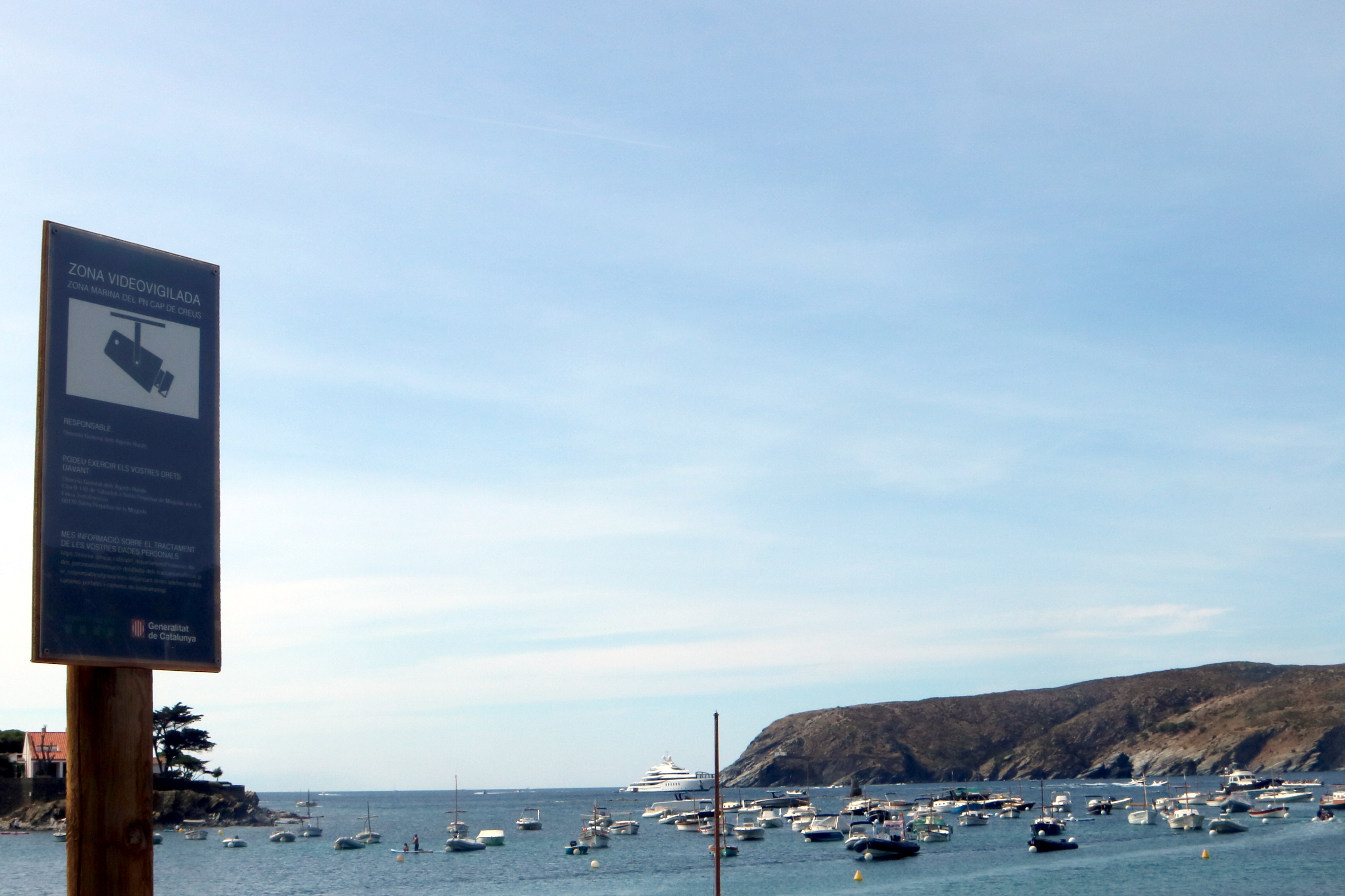 A sign indicating security cameras are in operation at Cap de Creus