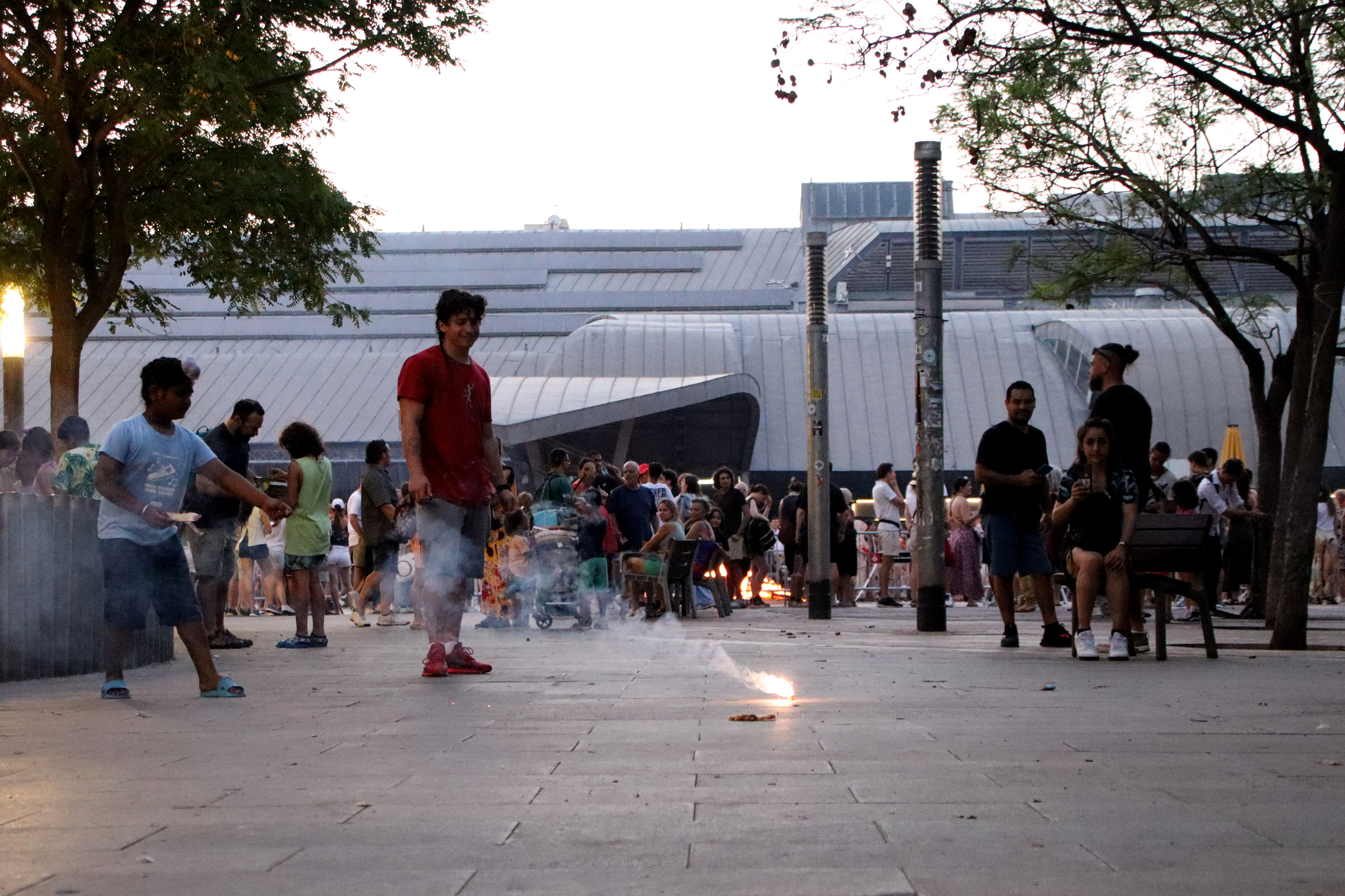 People lighting firecrackers in Barcelona