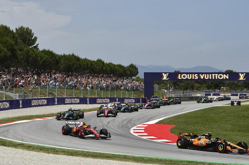 Several F1 cars, including Ferrari, Mclaren, and Mercedes cars at the Formula 1 Aramco Spanish Grand Prix 2025 in Montmeló