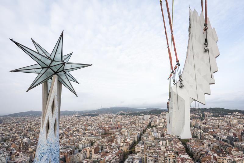 A wing gets placed on one of the towers of the Sagrada Família