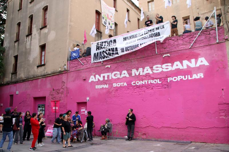 Activists outside the Antiga Massana building in Barcelona prevent its eviction