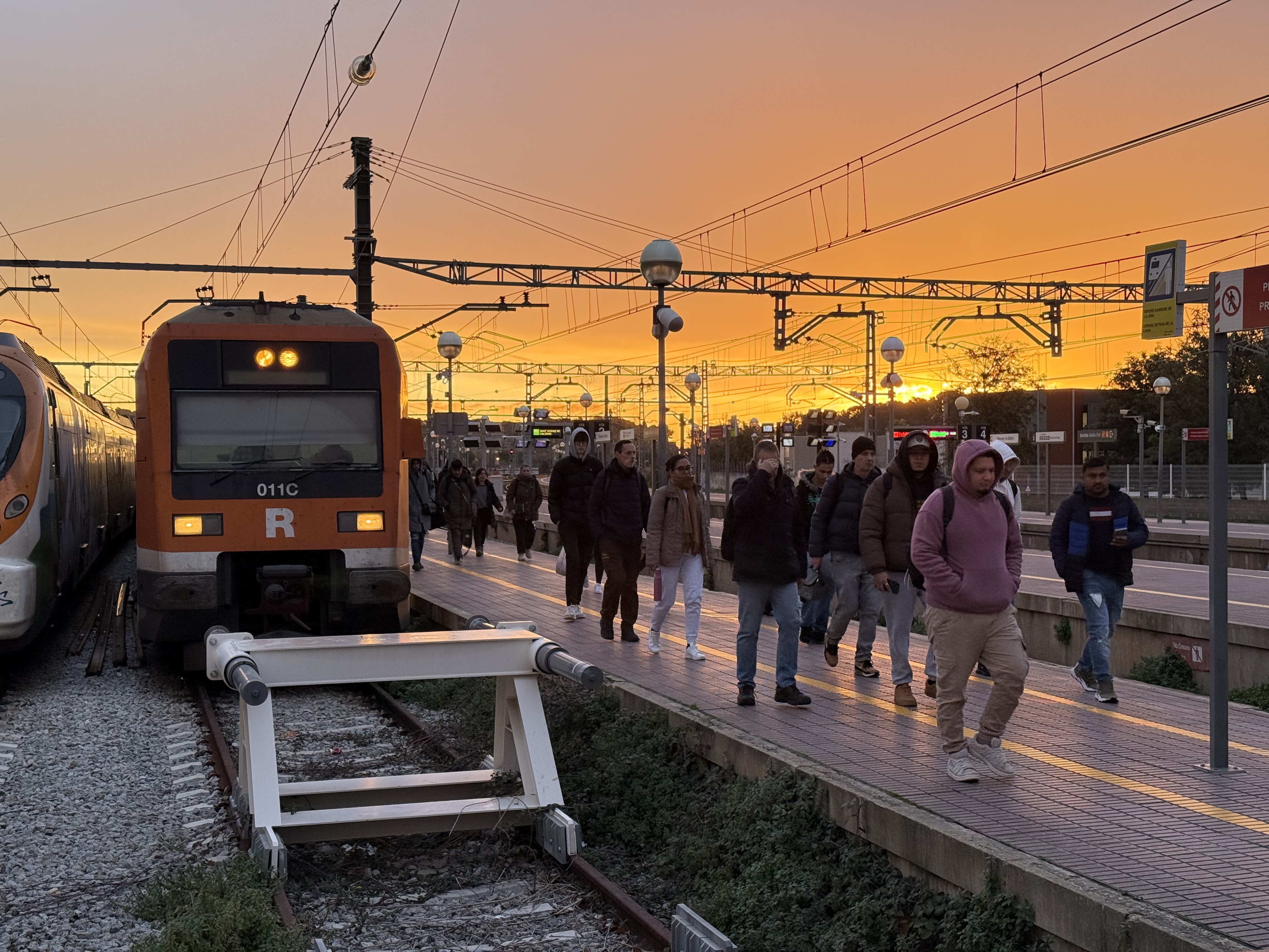 Passengers get off a train in Vilanova i la Geltrú