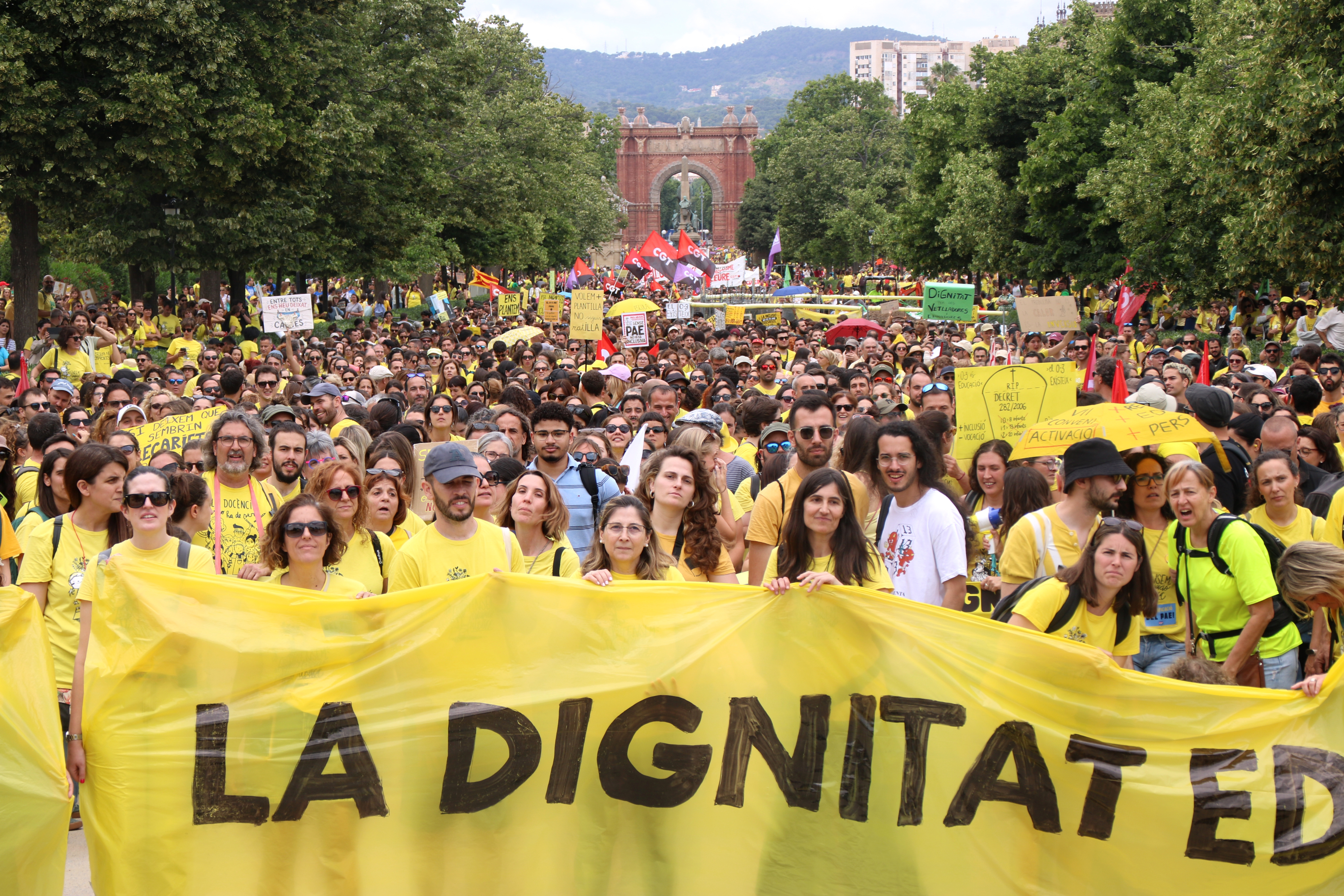 A banner calling for 'dignity' in education