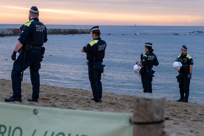 Barcelona Guàrdia Urbana police on the beach after Sant Joan festivities in the Catalan capital