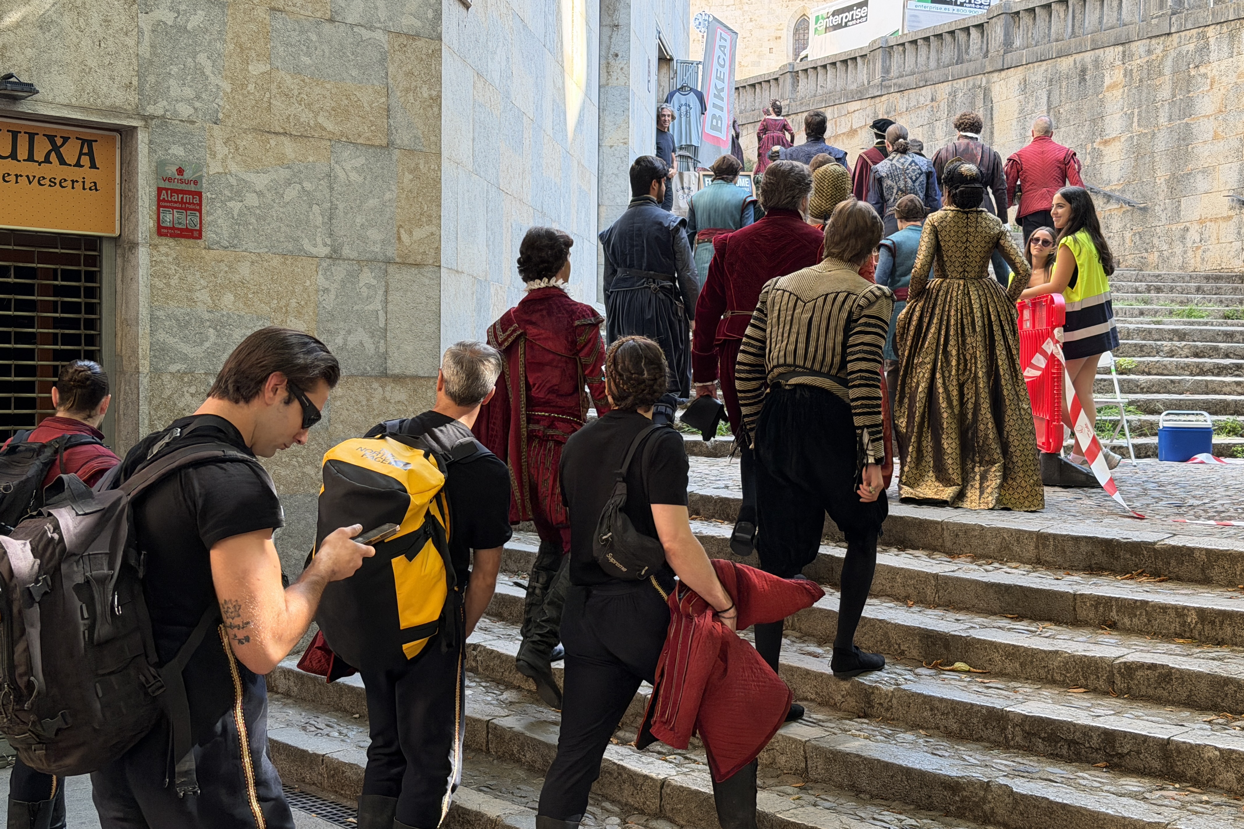 Some of the extras from the Disney film accessing the filming location in Girona