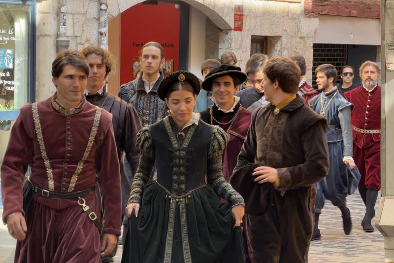 Some of the extras from the filming of 'Tangled' walk through the streets of the Barri Vell in Girona