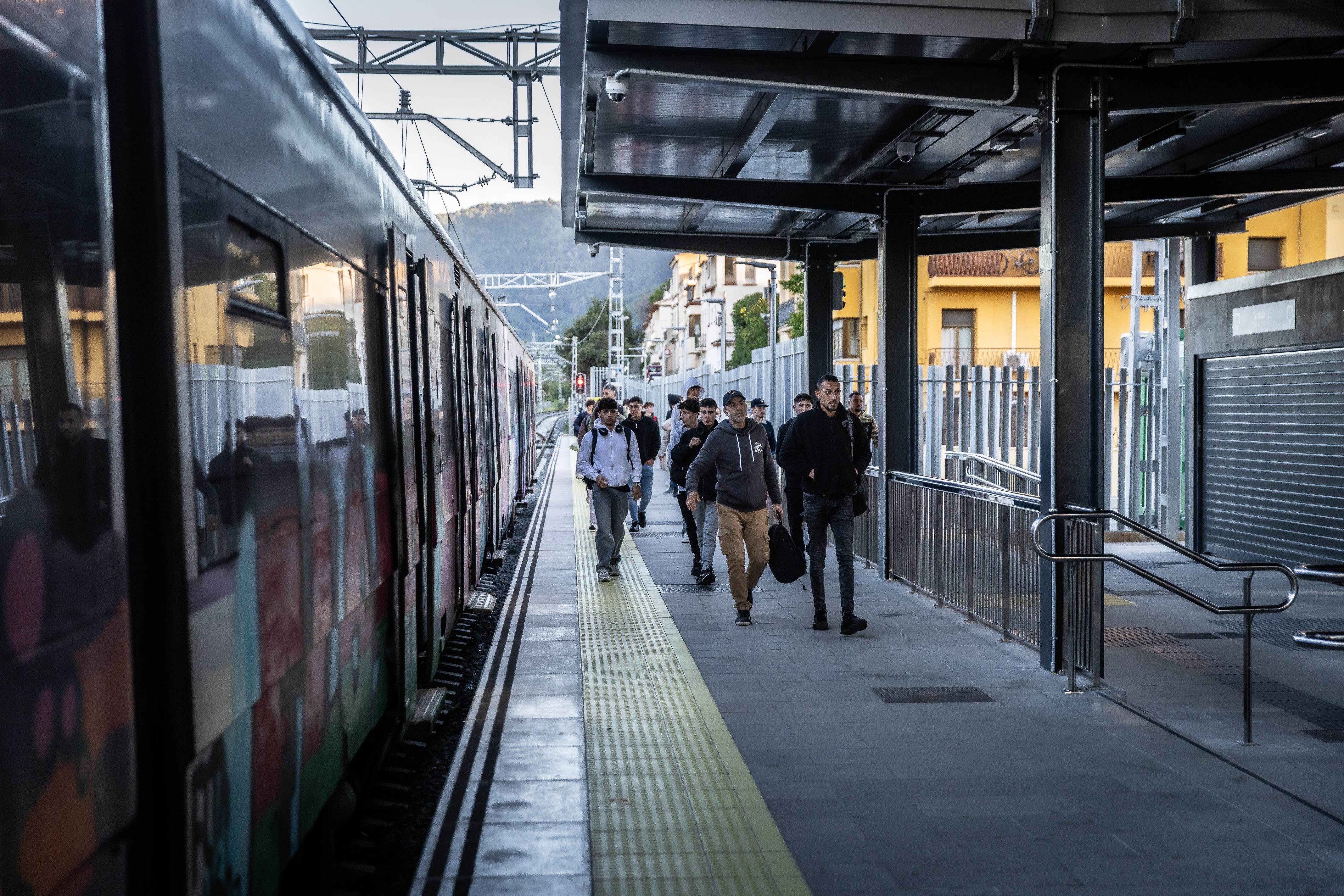 Several R3 rodalies passengers at La Garriga train station on the first day of the service disruptions on October 7, 2025