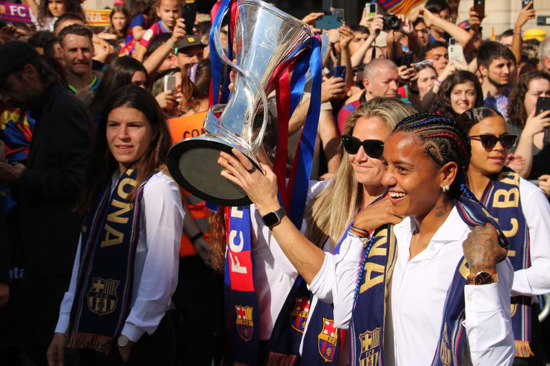 Barça Femení players show off the Champions League trophy in front of fans in June 2023