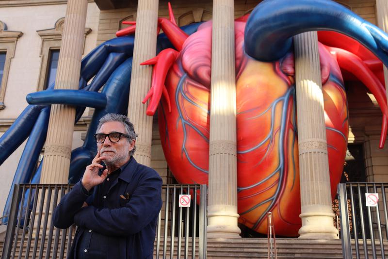 Artist Jaume Plensa in front of "The Secret Heart" in Barcelona's Hospital Clínic