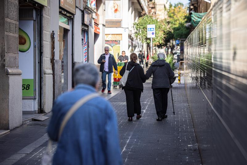 Older residents take a stroll in Barcelona