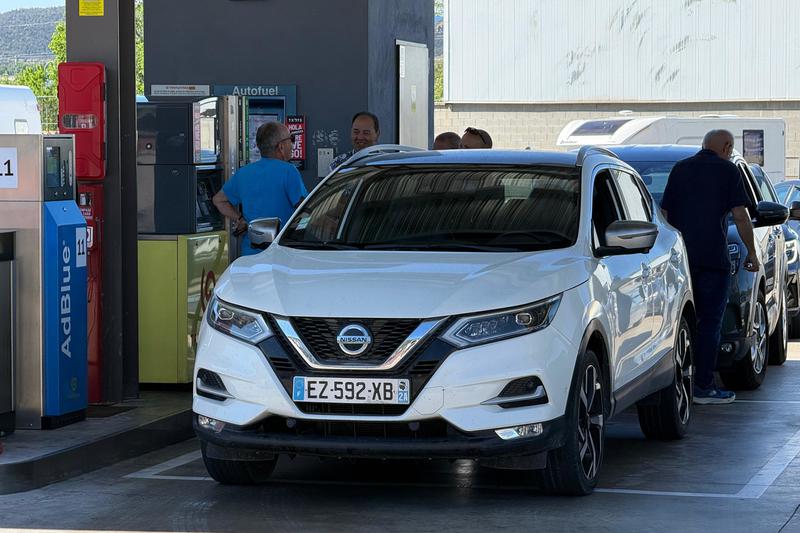 French drivers lining up at a gas station in La Jonquera